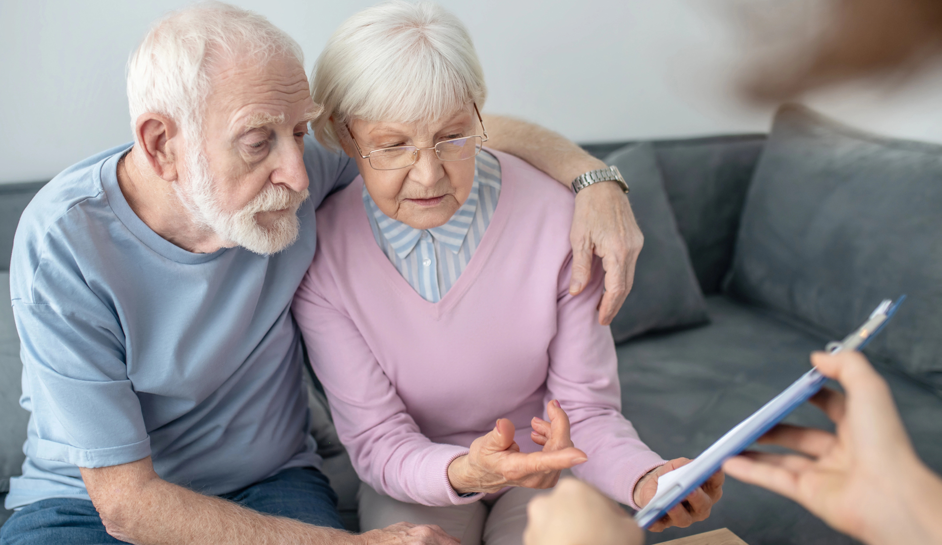 Elderly Couple Comparing Medicare Advantage Plans with Insurance Agents in Berne, Geneva, Fort Wayne, Decatur, Bluffton, IN, and the Surrounding Areas 
