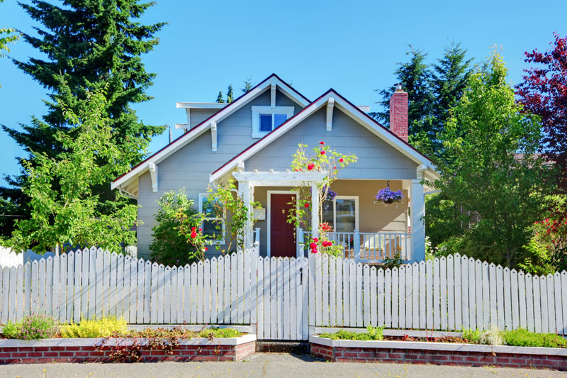 Cute home with white pickett fence protected by renters insurance in Fort Wayne